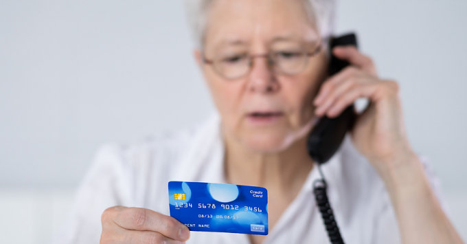 Lady on phone with credit card